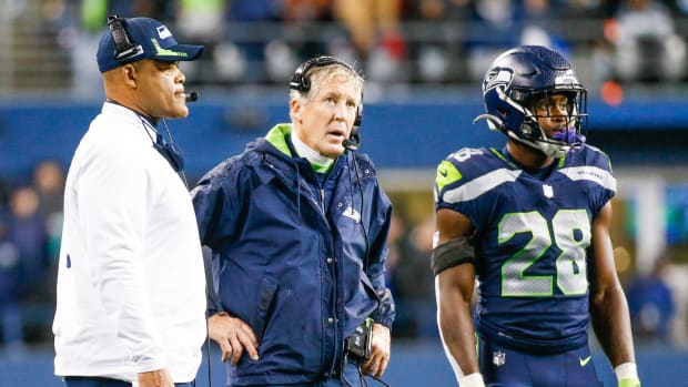 NFL: New Orleans Saints at Seattle Seahawks Oct 25, 2021; Seattle, Washington, USA; Seattle Seahawks defensive coordinator Ken Norton, Jr., left, head coach Pete Carroll, middle, and cornerback Ugo Amadi (28) stand near the sideline during a fourth quarter timeout against the New Orleans Saints at Lumen Field.